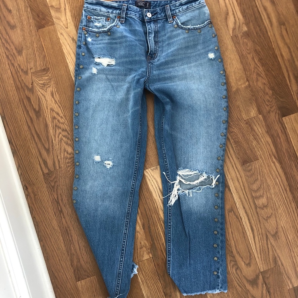 Medium wash studded jeans